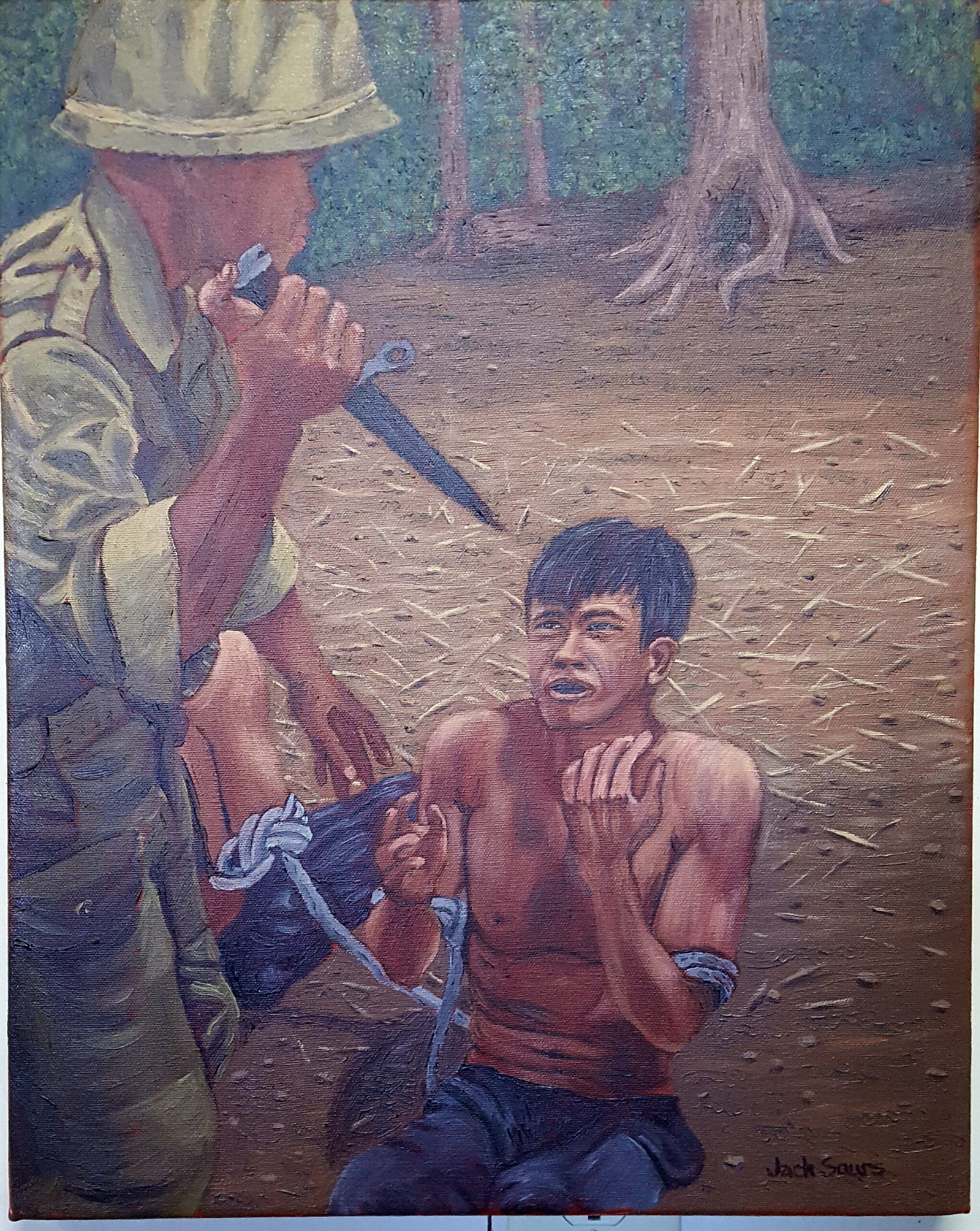 A soldier holding a knife on a Vietnamese man